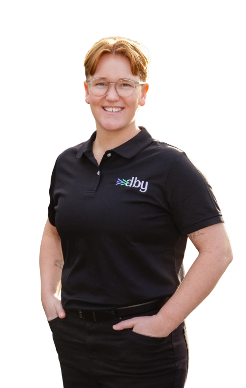 Bronwyn, owner of Driven By You. Young lady with short red hair and glasses
